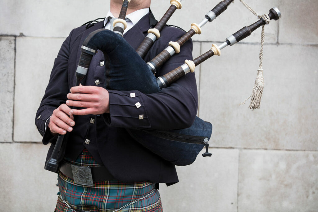 A Bagpiper holding the Bagpipes